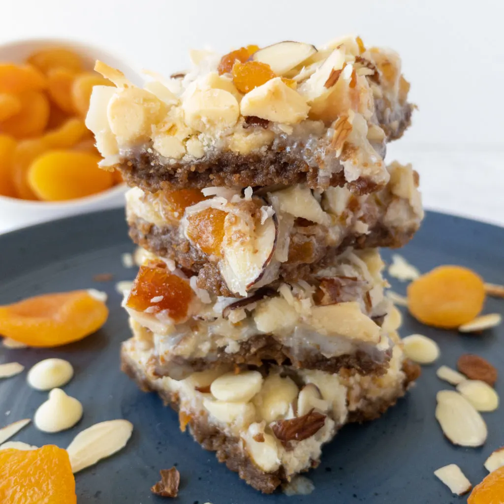 stack of apricot magic bars on plate