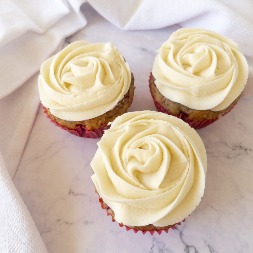 cupcakes frosted with white chocolate buttercream