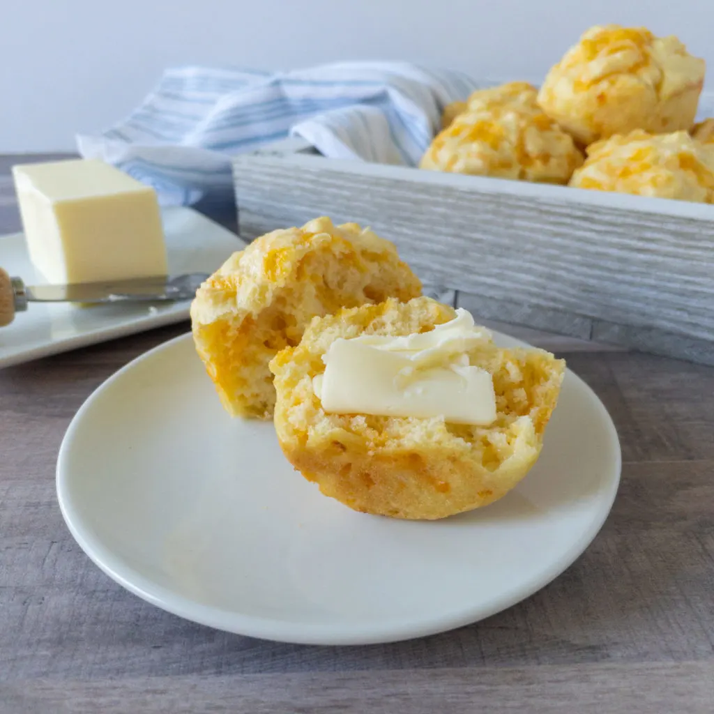 Cheese puff cut in half with butter