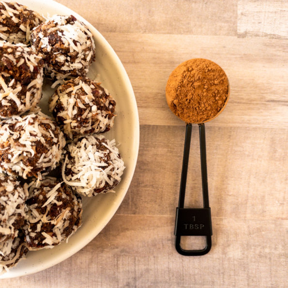 Cranberry Bliss Balls with cocoa powder