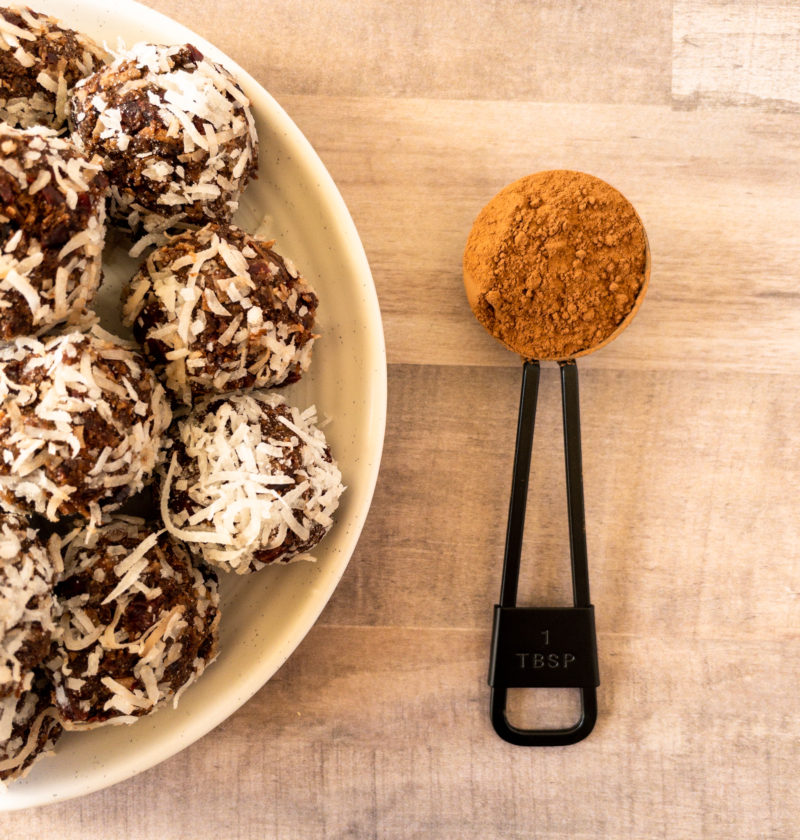Cranberry Bliss Balls with cocoa powder