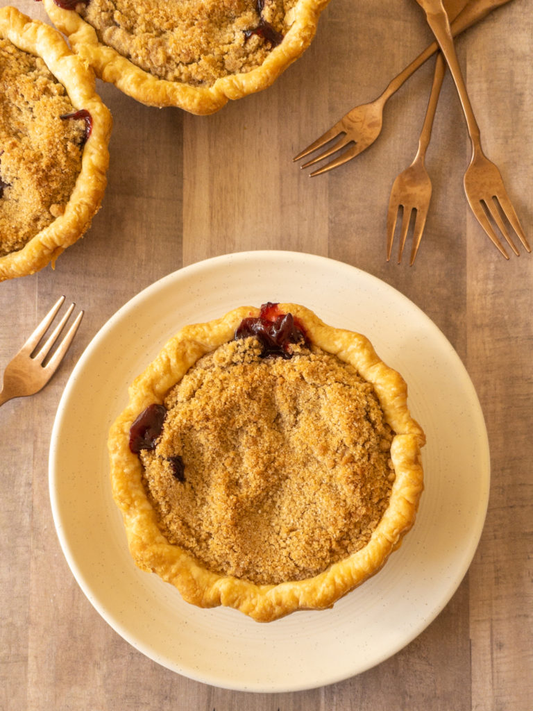 Three cherry pies with streusel topping