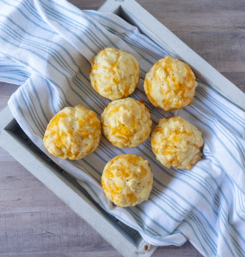 Birds eye view of six cheese puffs on a tray