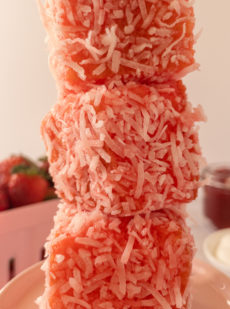 Stack of strawberry lamingtons