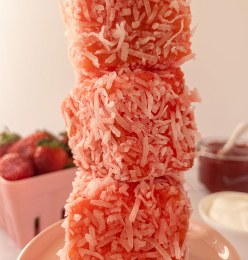 Stack of strawberry lamingtons