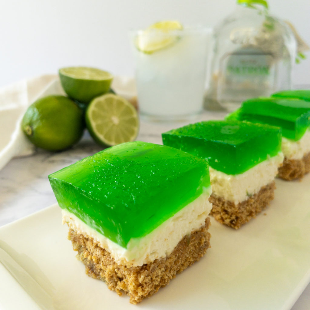 Margarita cheesecake bars lined up on plate