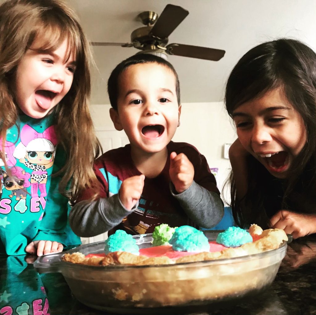Happy kids with imaginary pie