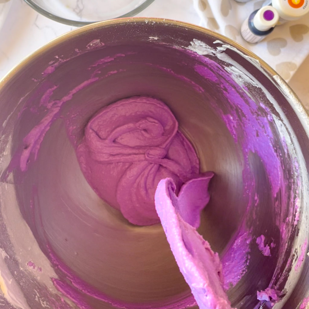 Figure 8 made from purple macaron batter in bowl