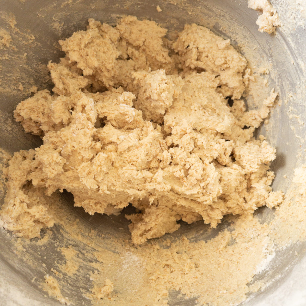 Cookie dough once flour has been added in mixing bowl