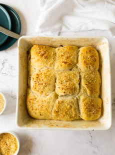 Baked cheese and onion stuffed rolls in baking dish