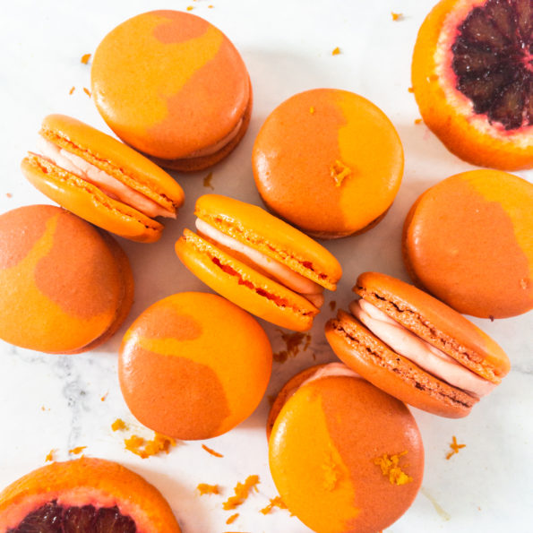 12 macarons lined up on counter