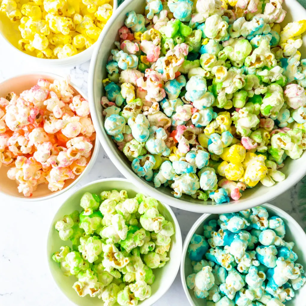 colored candy popcorn separated into bowls