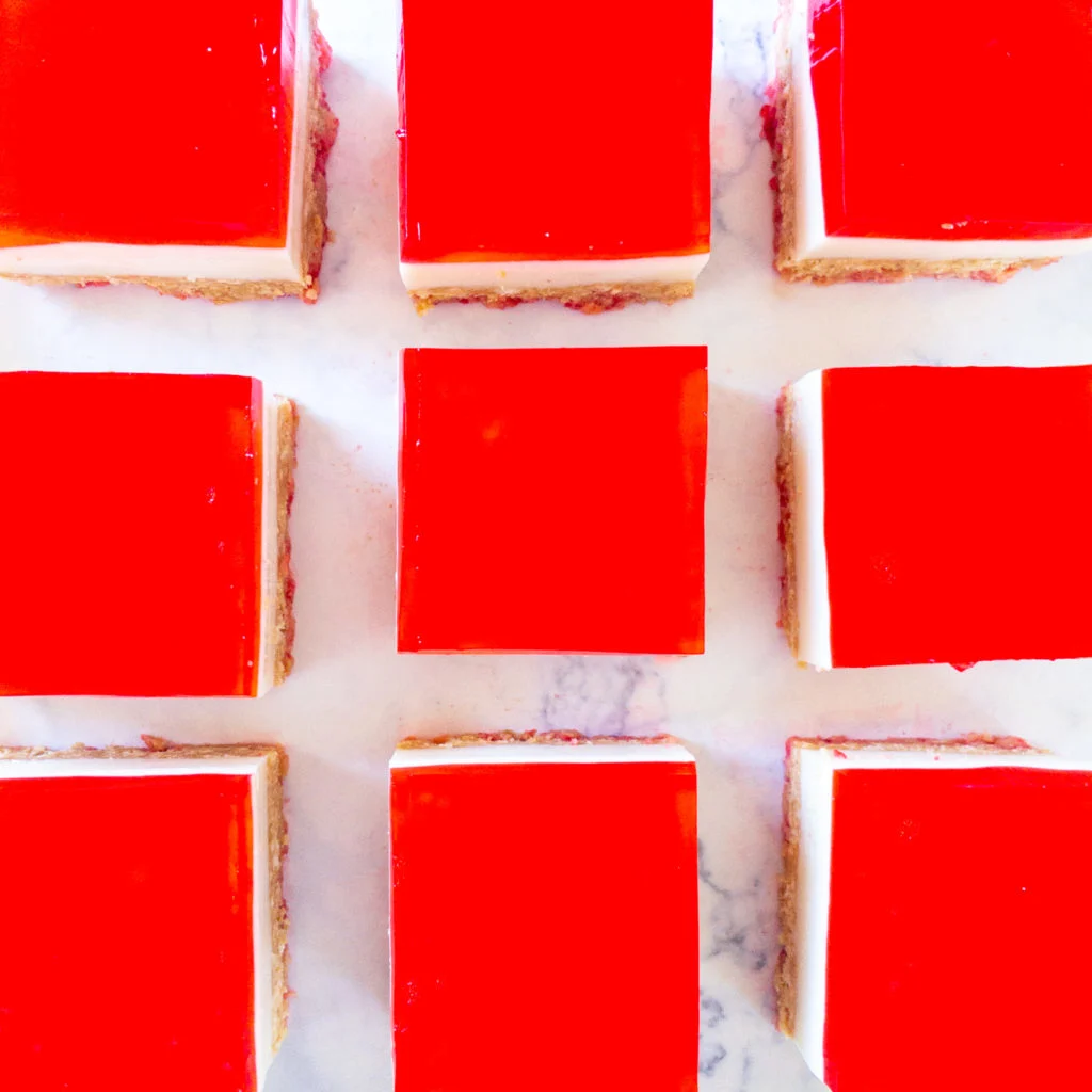 overhead shot of no bake jelly slice in a row