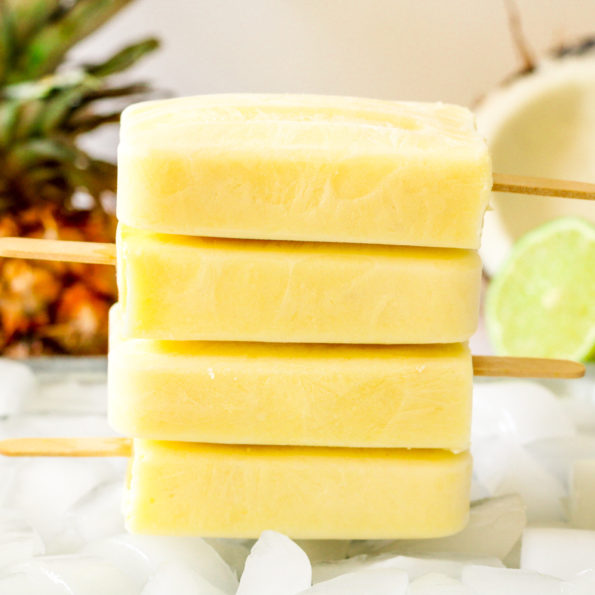 four piña colada popsicles stacked