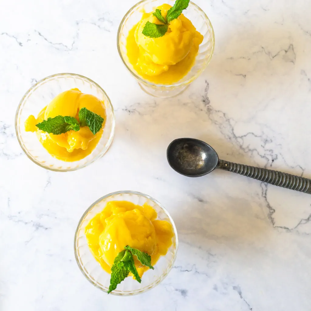 three glasses of two ingredient mango sorbet