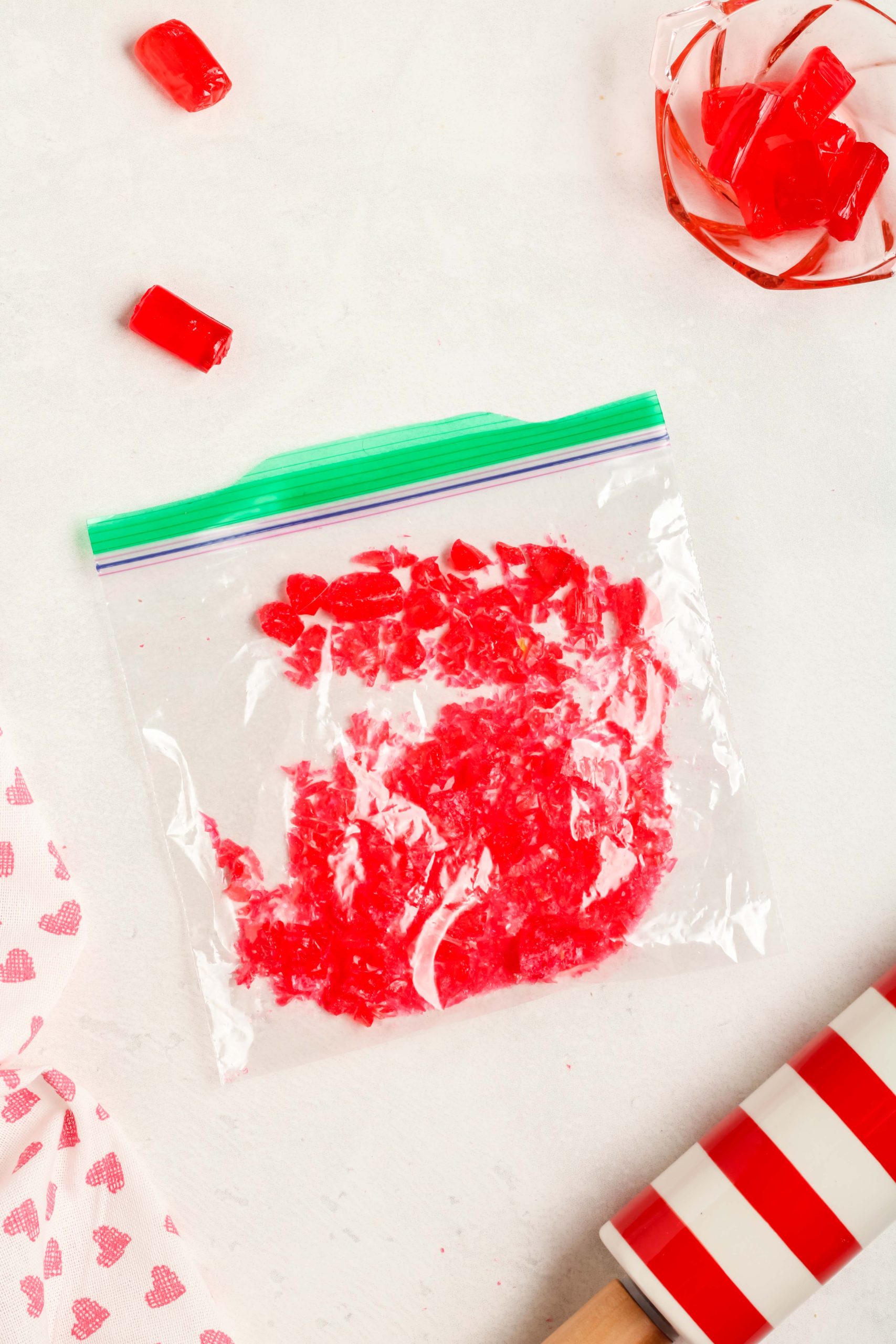 Crushed red jolly ranchers in a ziplock bag